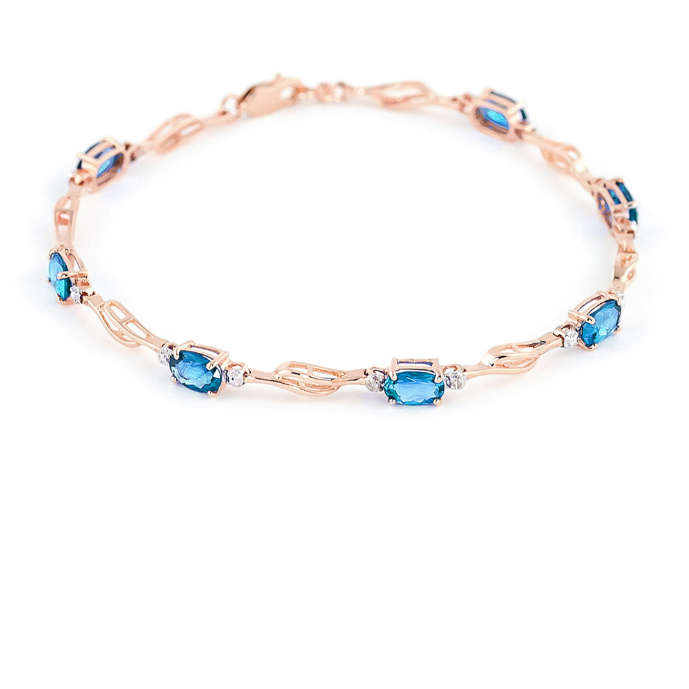 14K. GOLD TENNIS BRACELET WITH BLUE TOPAZ & DIAMONDS (Rose Gold) - Picture 1 of 4